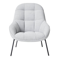 Light gray upholstered chair with a quilted pattern and sleek black metal legs. Perfect for modern interiors.