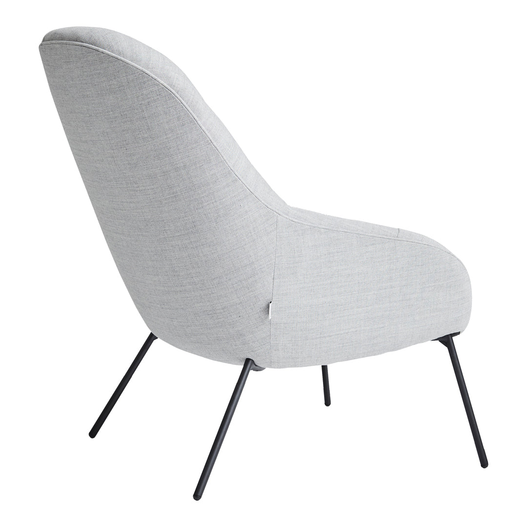 Light gray upholstered chair with a sleek design and black metal legs. Modern and minimalist look.