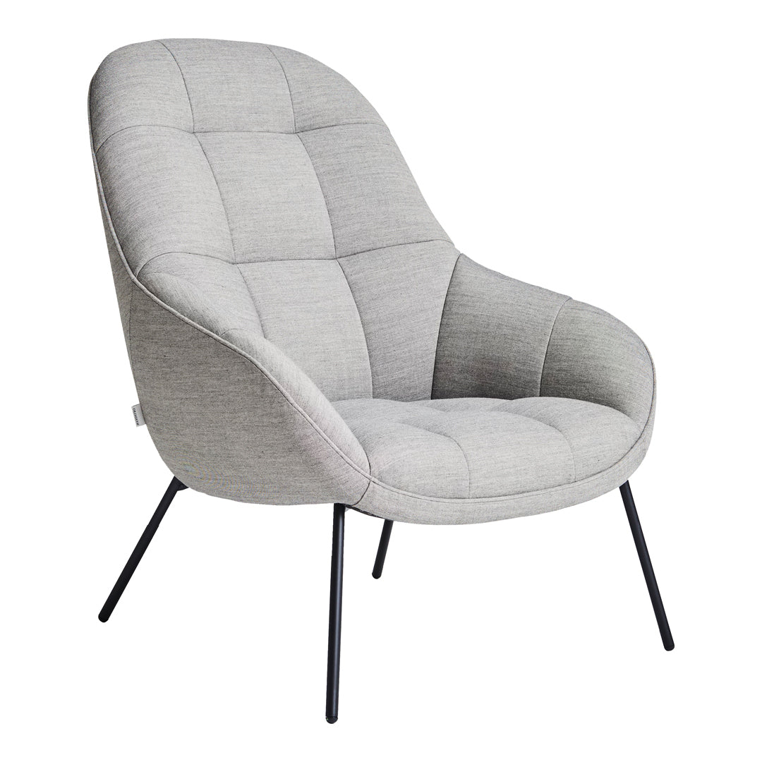 Light gray upholstered chair with a modern quilted pattern and sleek black metal legs.