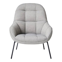 Light grey chair with a quilted pattern and curved design, featuring black metal legs for a modern look.