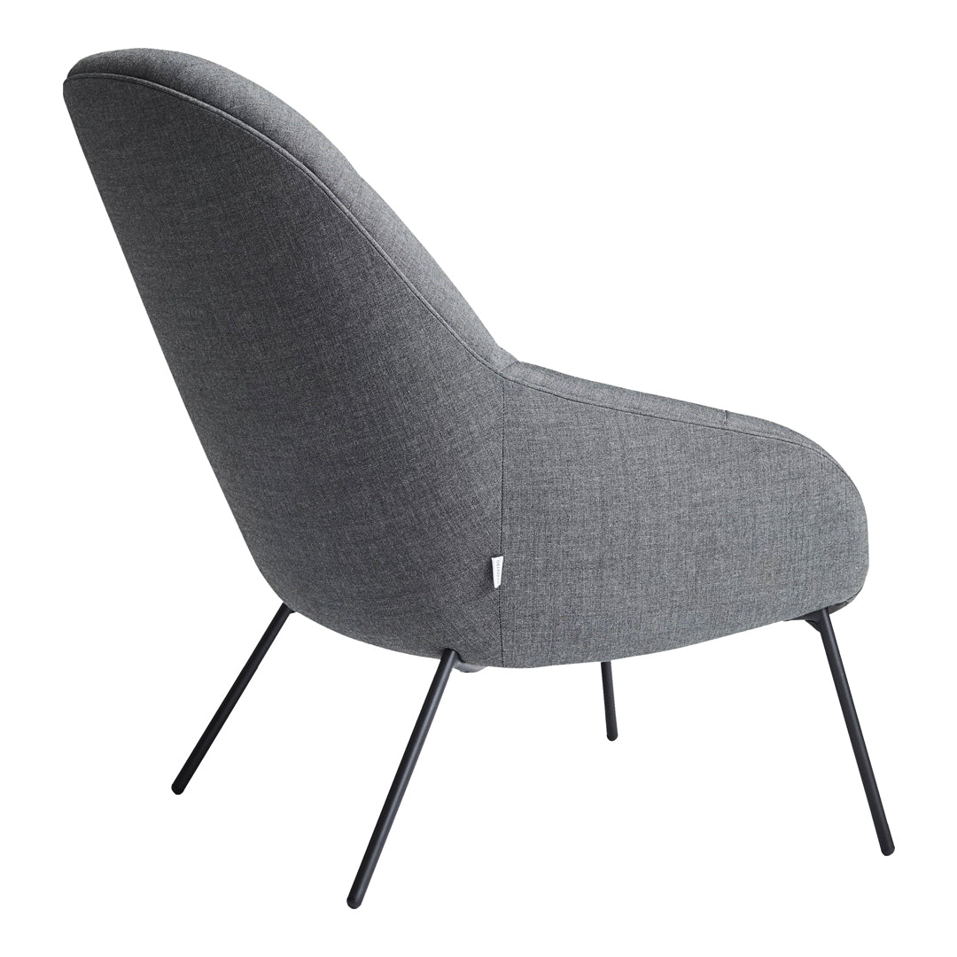 Gray upholstered chair with a smooth finish and slender black legs, showcasing a modern and minimalist design.