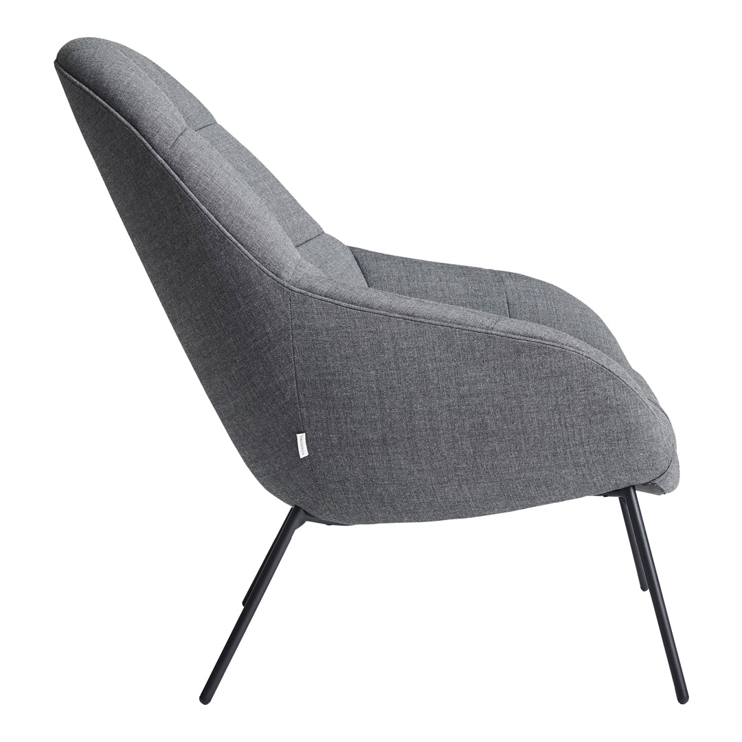 Gray upholstered chair with a sleek, modern design and subtle textured fabric, complemented by black metal legs.