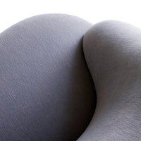 Curved gray upholstery with a subtle textured pattern, showcasing modern and sleek design elements.