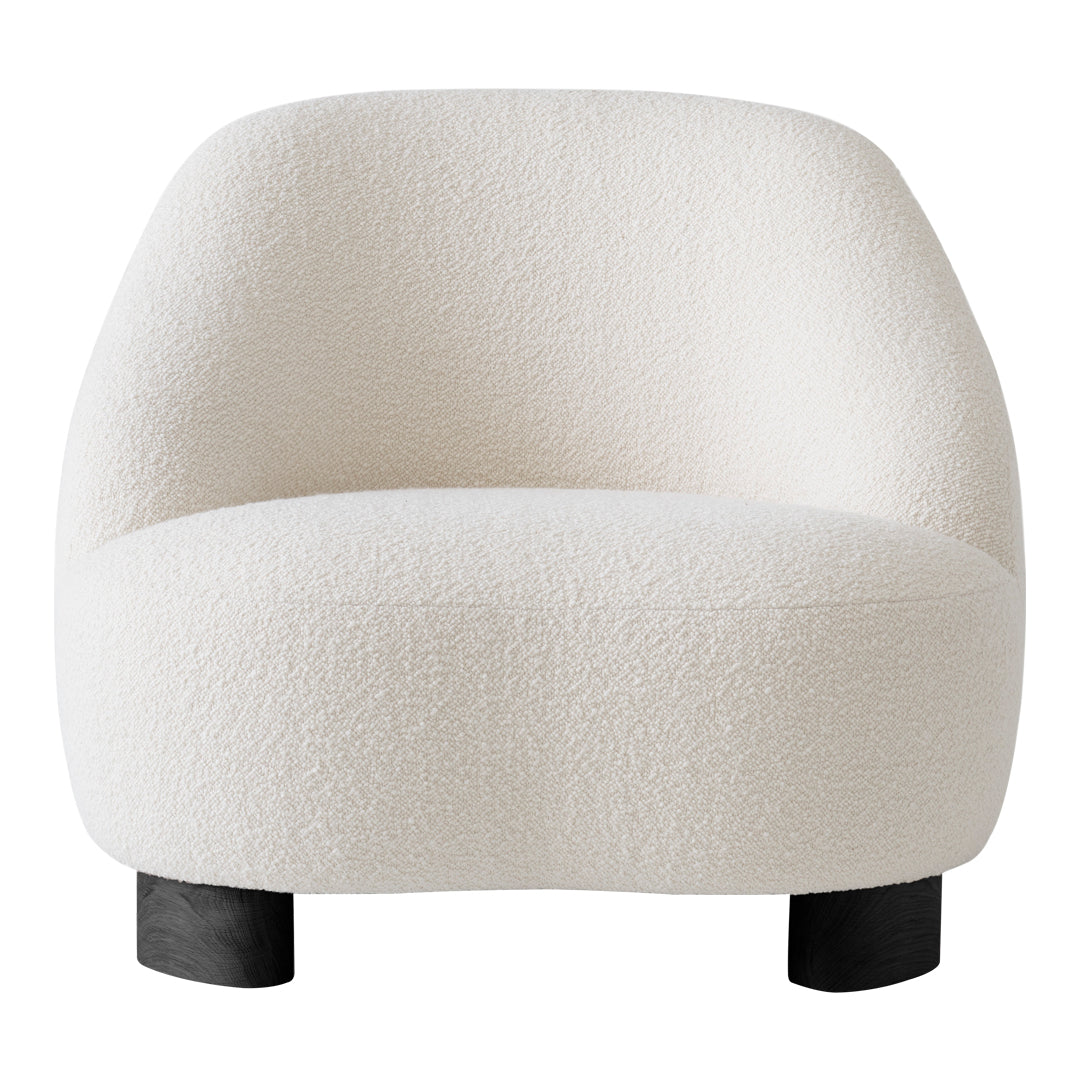 White textured chair with a soft, plush fabric and rounded design, featuring sleek black legs.
