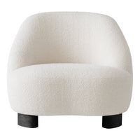 White textured chair with a soft, plush fabric and rounded design, featuring sleek black legs.