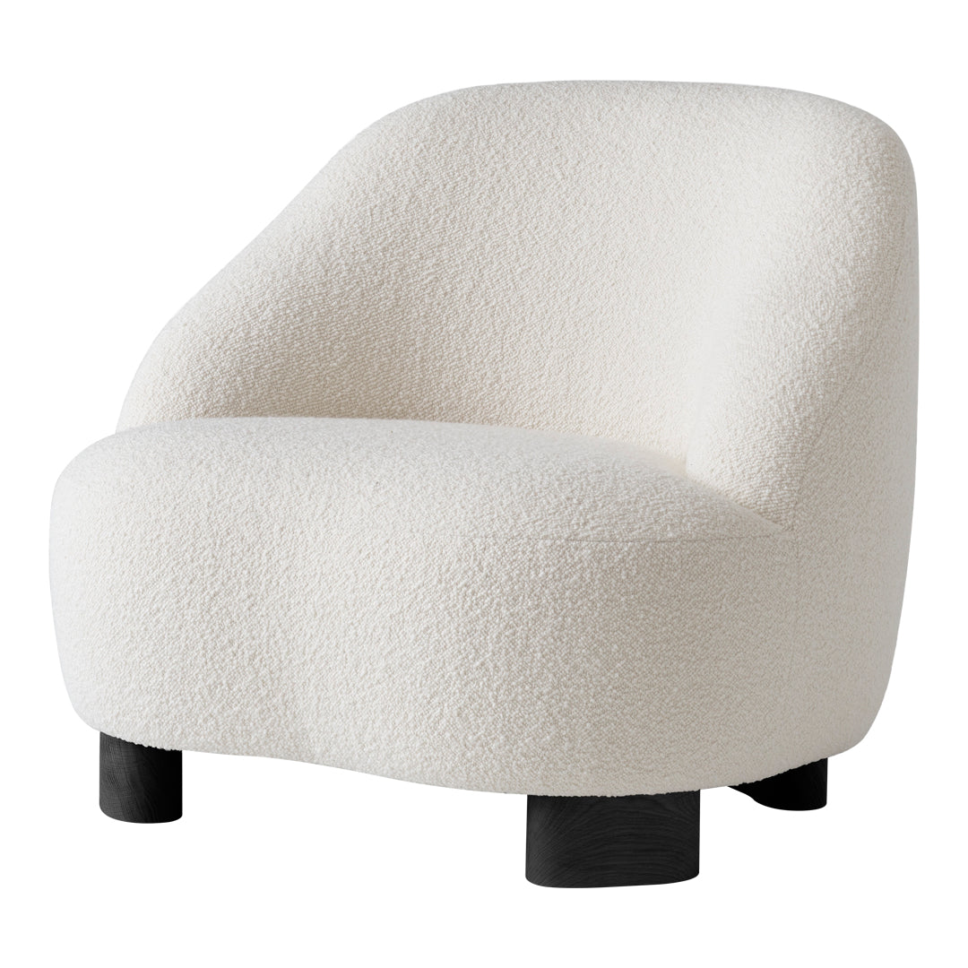 Cream textured armchair with a soft, rounded design and black wooden legs. Ideal for modern decor.