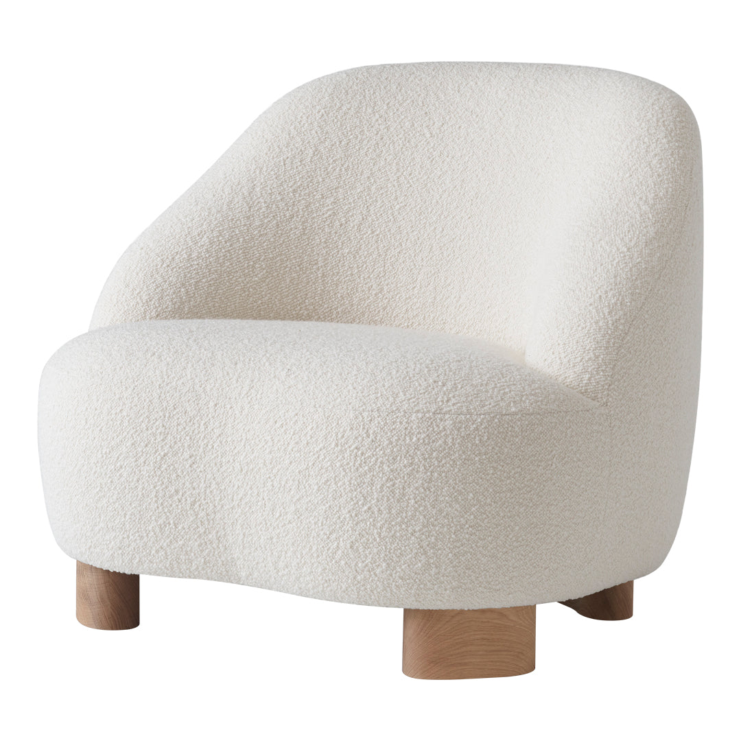 Cozy white textured armchair with rounded shape and wood legs, perfect for modern interiors.