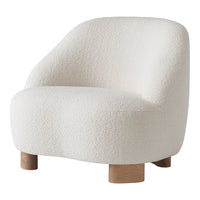 Cozy white textured armchair with rounded shape and wood legs, perfect for modern interiors.