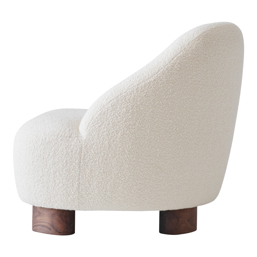 White textured upholstery with a soft, curved silhouette and wooden legs, ideal for modern decor.