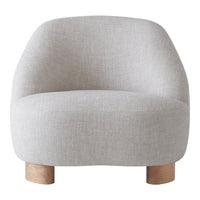 Light gray rounded chair with soft fabric texture and natural wood legs. Ideal for modern, minimalistic interiors.