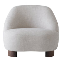 Light gray upholstered chair with smooth curves and wooden legs. Ideal for modern and minimalist decor.