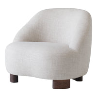 Light beige upholstered chair with a soft, smooth texture and dark wooden legs, showcasing minimalist style.