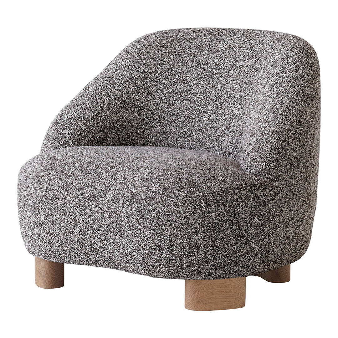 Textured gray chair with a soft finish and wooden legs, showcasing a modern and cozy aesthetic.