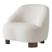 White boucle fabric accent chair with rounded shape and dark wood legs. Ideal for modern, cozy interiors.