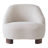 Minimalist cream armchair with a smooth texture and wooden legs. Elegant and modern design for stylish interiors.