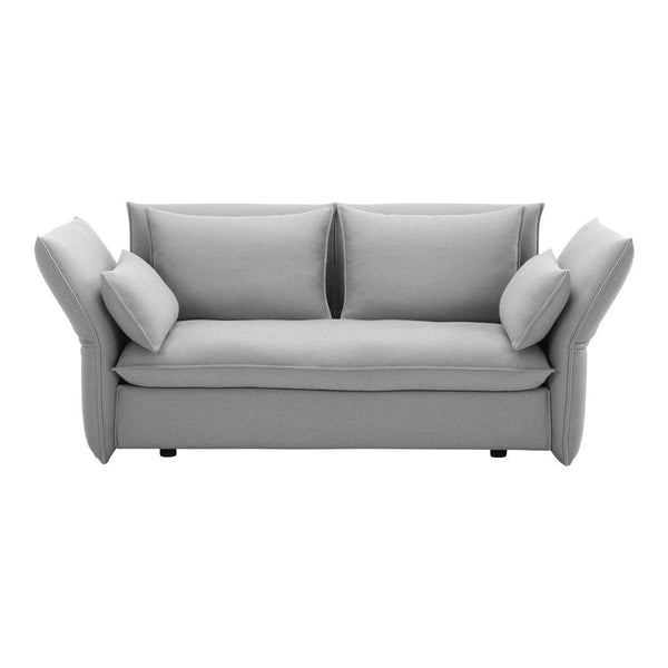 Gray upholstered sofa with a smooth texture and plush, oversized cushions. Modern design with soft, neutral tones.