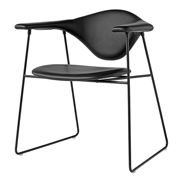 Sleek black modern chair with a minimalist design and smooth curves on a contrasting black metal frame.