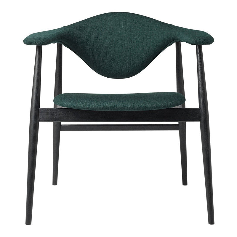 "Green upholstered chair with a sleek black frame, featuring a smooth, curved backrest."