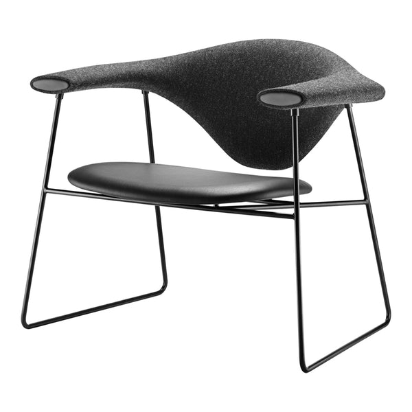 Modern black chair with a sleek, curved design and textured gray fabric upholstery, featuring minimalist wire legs.