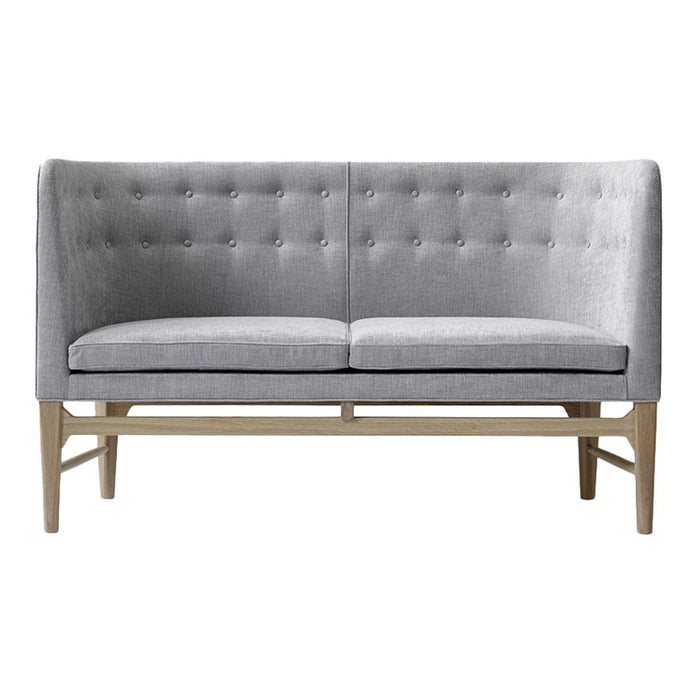 Gray tufted loveseat with a sleek design and light wooden legs, perfect for modern interiors.