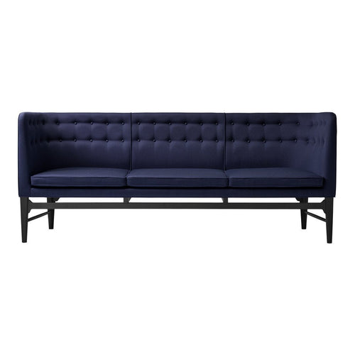 Navy blue tufted sofa with black wooden legs, featuring a sleek, modern design and solid color pattern.