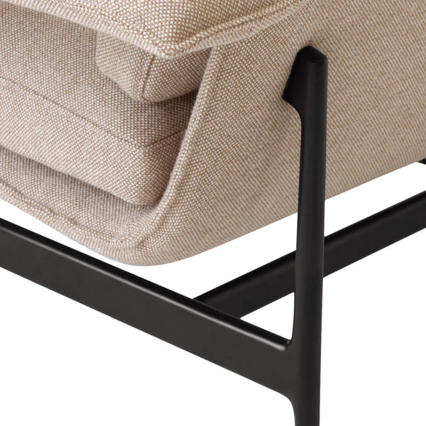 Neutral beige upholstery with a subtle texture, paired with a sleek black metal frame. Perfect for modern decor.