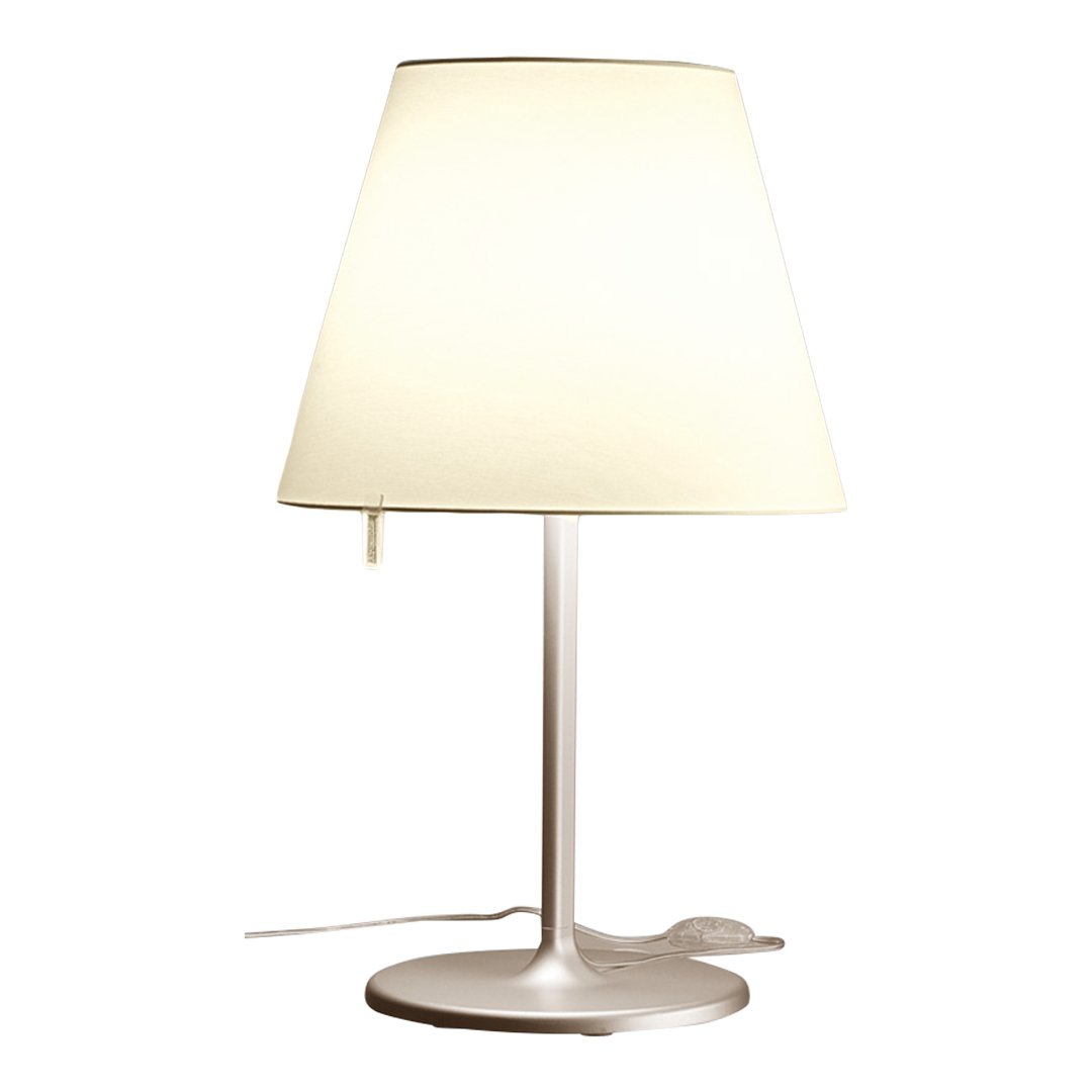 Modern white lamp with a tapered shade and sleek silver base, perfect for any contemporary decor.