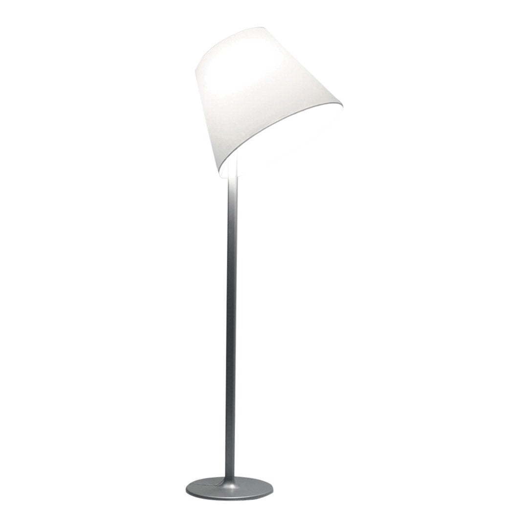 Modern floor lamp with a sleek silver base and a curved white shade, featuring a minimalist design.