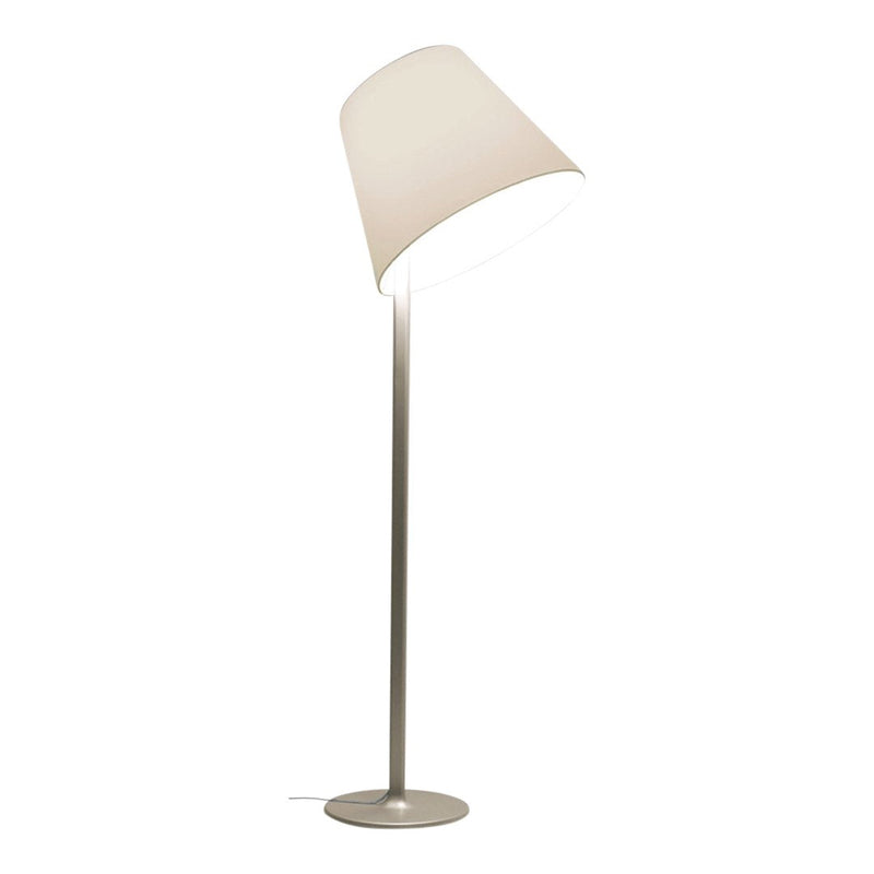 Modern white floor lamp with a sleek silver base and minimalist design, featuring a soft, neutral color palette.