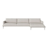 Light gray sectional sofa with clean lines and smooth upholstery, featuring a minimalist design and subtle texture.
