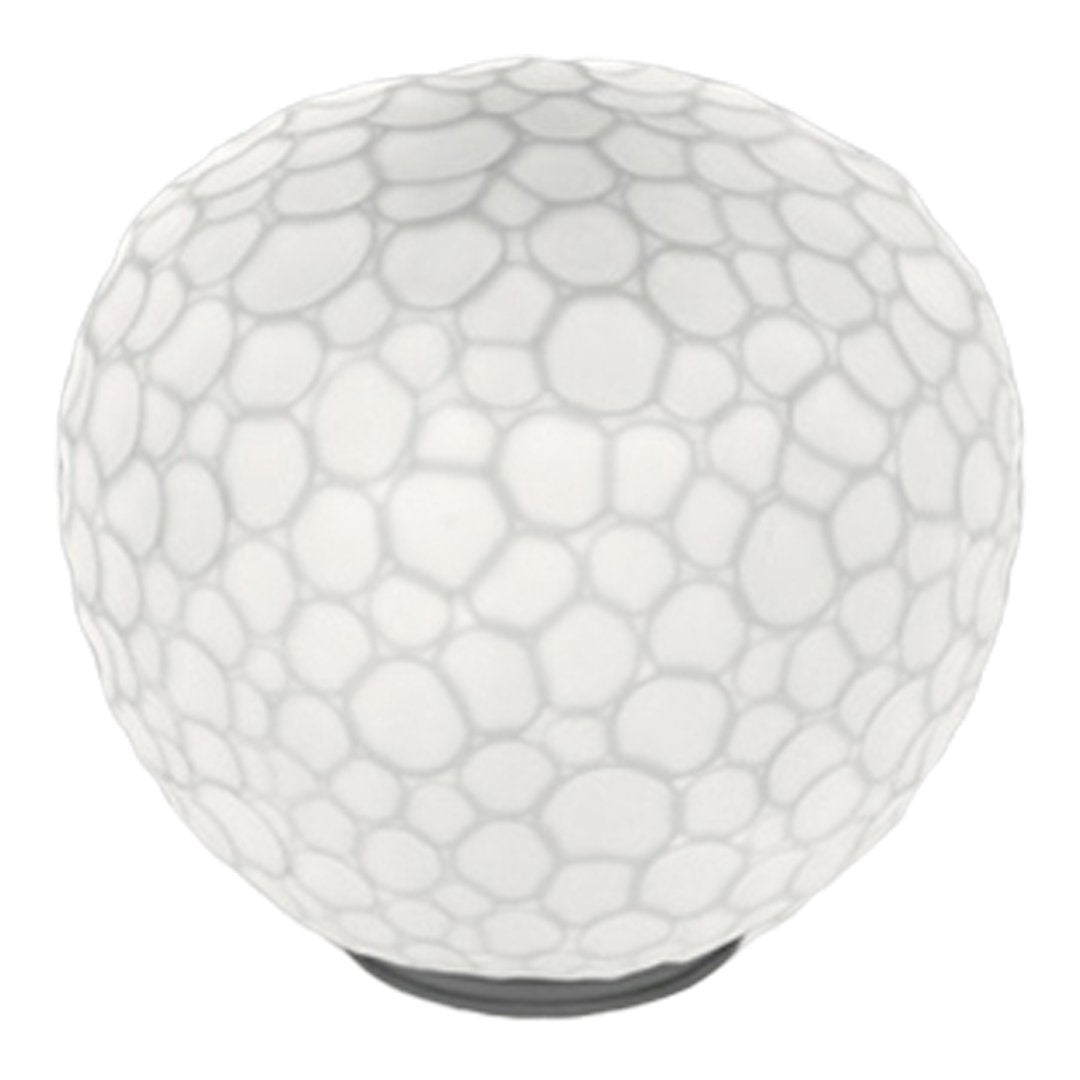 White round lamp with a textured bubble pattern and a sleek black base, ideal for modern decor.