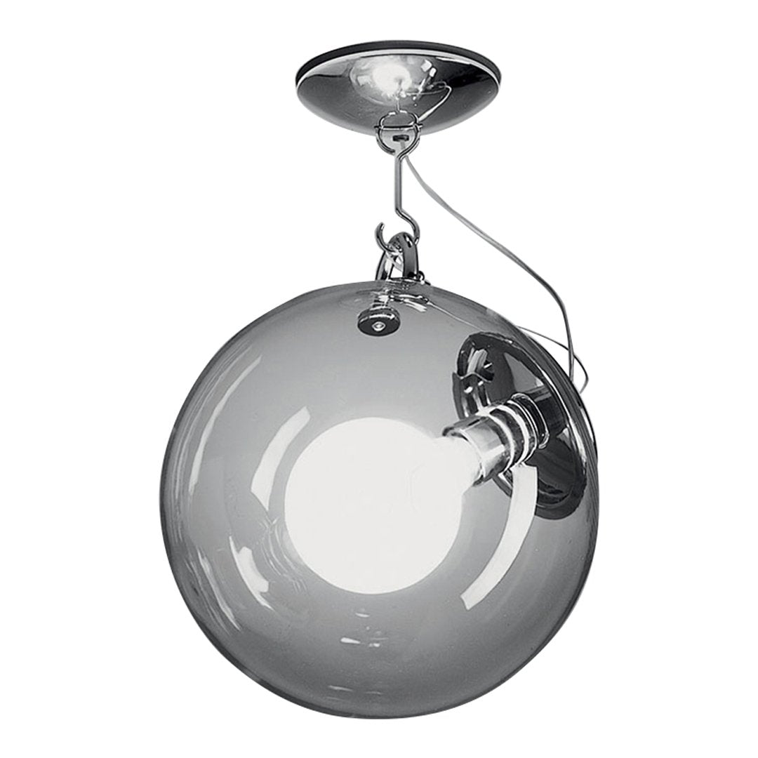 Stylish chrome pendant light with a clear glass globe and round, minimalist design. Perfect for modern decor.
