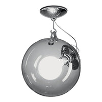 Stylish chrome pendant light with a clear glass globe and round, minimalist design. Perfect for modern decor.