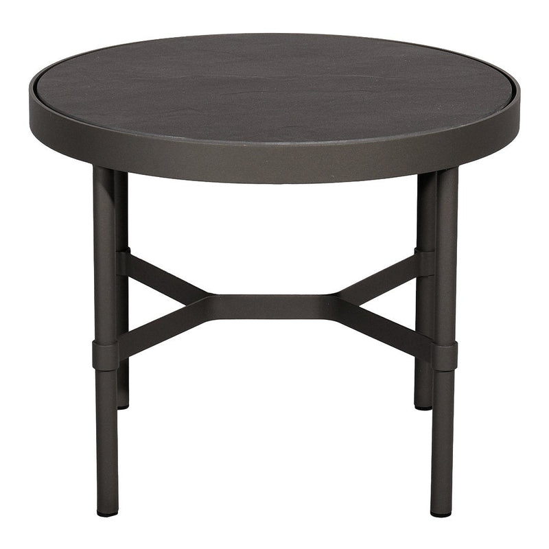 Round black coffee table with a smooth top and minimalist metal frame, featuring a sleek, modern design.