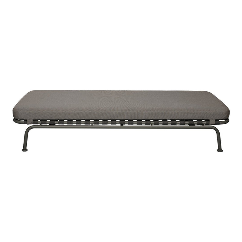 Gray cot with a smooth, solid surface and a sleek, black metal frame. Modern and minimalist design.