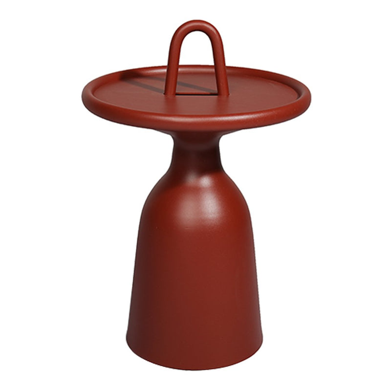 Round terracotta side table with smooth matte finish and a modern design. Features a minimalist silhouette and contrasting handle.