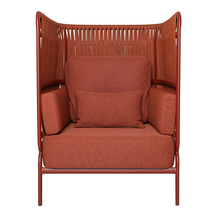 Rust orange armchair with textured woven back and matching cushions, perfect for stylish indoor seating.
