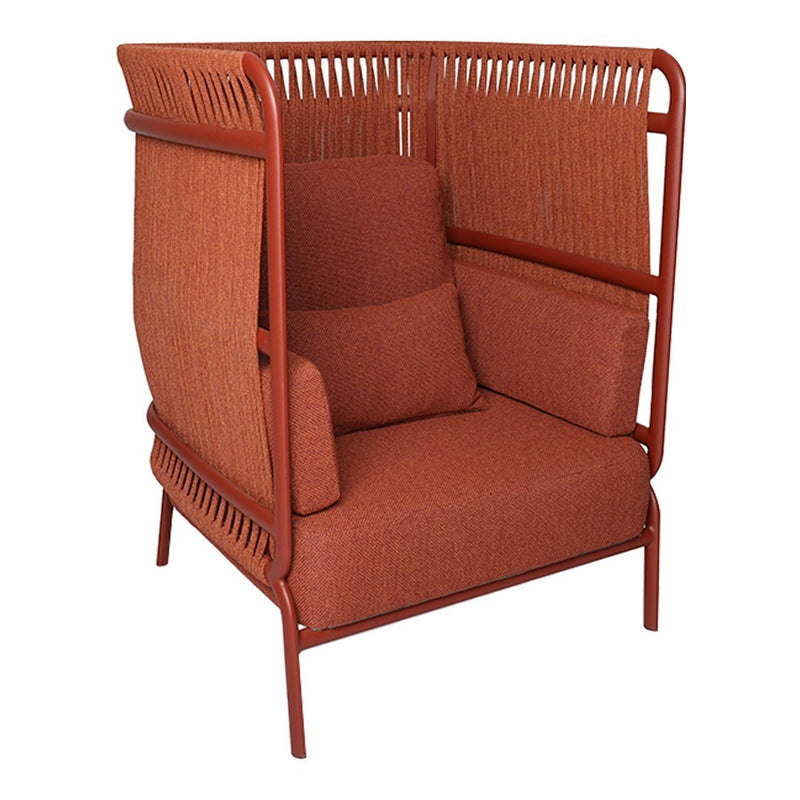 Rusty orange upholstered armchair with patterned backrest and plush cushions, perfect for stylish, cozy seating.