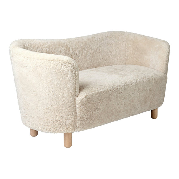 Textured beige sofa with soft, fluffy upholstery and light wooden legs, perfect for cozy, modern interiors.