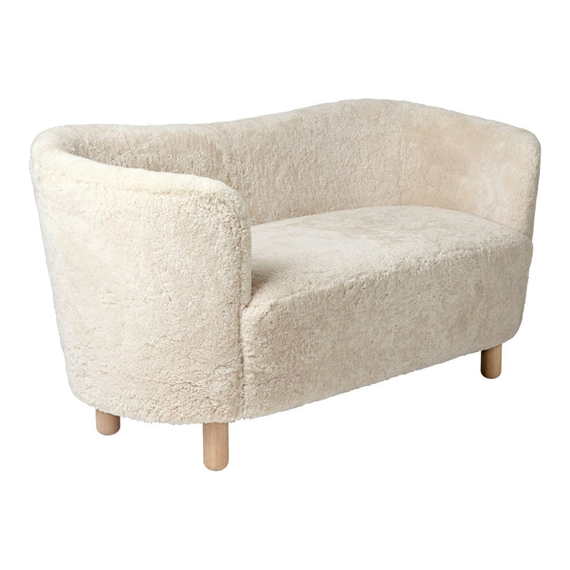 Textured beige sofa with soft, fluffy upholstery and light wooden legs, perfect for cozy, modern interiors.