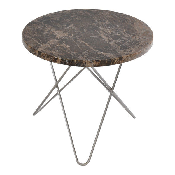 Round table with a dark marble surface and sleek metallic legs, featuring subtle veins and a contemporary design.