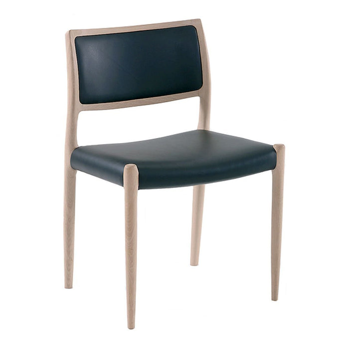 Modern chair with a navy blue leather seat and backrest, complemented by light wooden legs. Minimalist design.