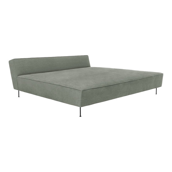 Modern green upholstered bed frame with sleek lines and a minimalist design. Ideal for contemporary interiors.