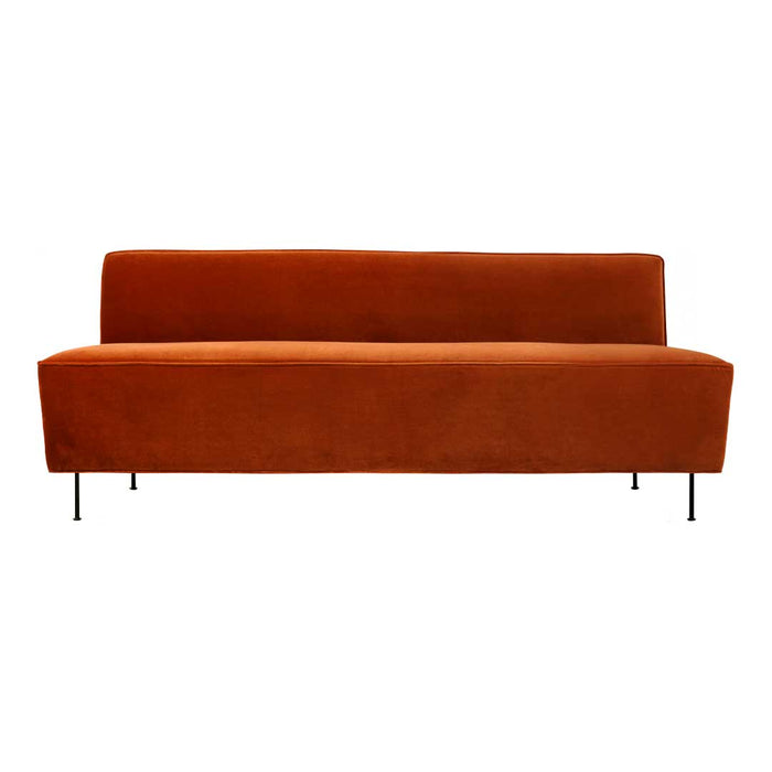 Rust orange velvet sofa with a minimalist design and sleek black legs, perfect for modern decor.