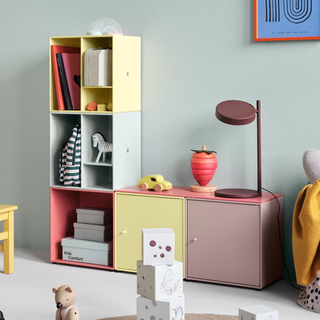 Colorful geometric shelving unit in pastel yellow, mint green, and soft pink with playful patterns. Ideal for modern decor.