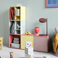 Colorful geometric shelving unit in pastel yellow, mint green, and soft pink with playful patterns. Ideal for modern decor.
