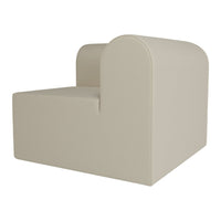 Beige modern chair with soft curves and a minimalist design, featuring a smooth texture and seamless finish.