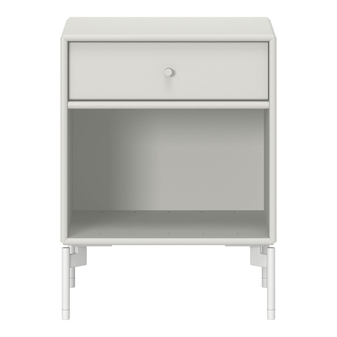 White nightstand with a minimalist design, featuring a smooth surface and simple lines. Ideal for modern decor.
