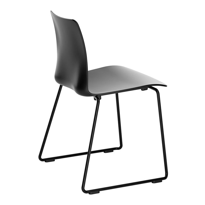 Black modern chair with sleek curves and a minimalist design, featuring a solid black frame and seat.
