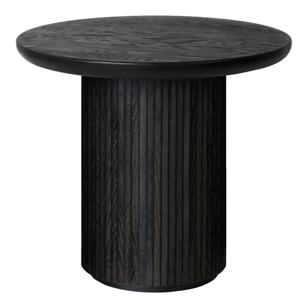 Round black table with a textured surface and vertical stripe pattern on the base, offering a sleek modern look.